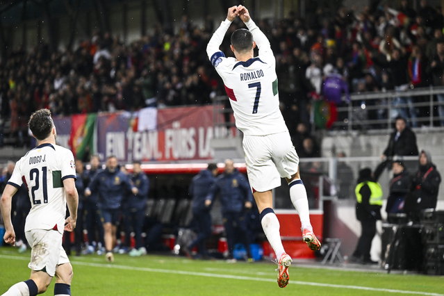 Portugal's Cristiano Ronaldo celebrates after scoring the 0-1 goal during the UEFA Euro 2024 qualification Group J soccer match between Liechtenstein and Portugal, in Vaduz, Liechtenstein, 16 November 2023. (Photo by Gian Ehrenzeller/EPA)