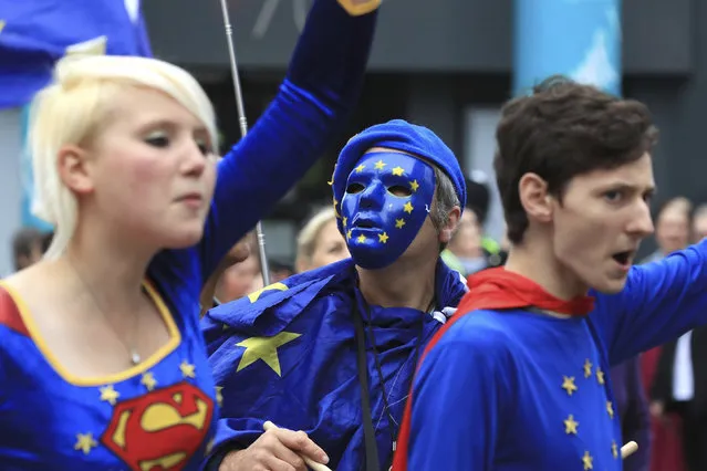 Demonstrators dressed as super-heroes during a Stop Brexit march making its way towards the Conservative party conference being held at the Manchester Central Convention Complex in Manchester, England, Sunday October 1, 2017.  The ruling Conservative Party is holding its annual conference with Prime Minister Theresa May facing fresh party tensions over how to manage Britain's Brexit departure from the European Union. (Photo by Peter Byrne/PA via AP Photo)