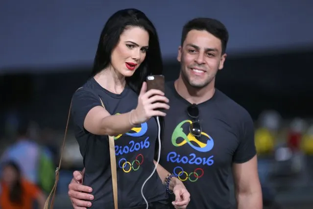 2016 Rio Olympics, Opening ceremony, Maracana, Rio de Janeiro, Brazil on August 5, 2016. A couple takes a selfie before the opening ceremony. (Photo by Mike Blake/Reuters)