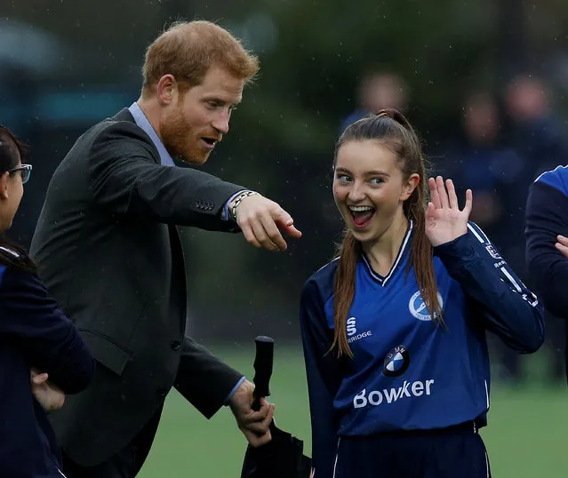 Prince Harry watches a football training session during a visit to the Sir Tom Finney Soccer Development Centre at the UCLan Sports Arena on October 23, 2017 in Preston, England. (Photo by Andrew Yates/Reuters)