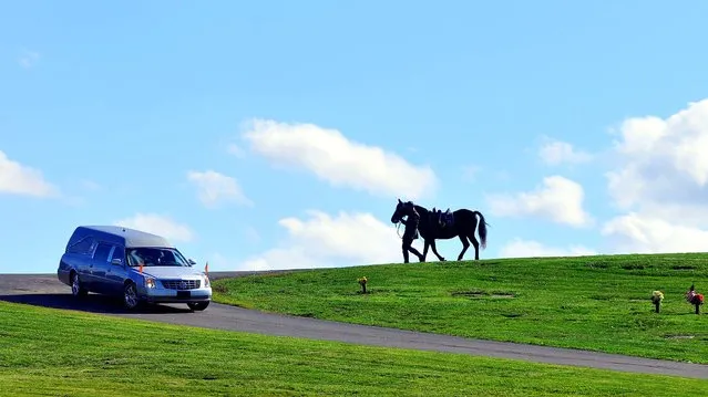 Trooper Mike Funk follows a hearse leading a riderless horse through St. Mary's Cemetery during the funeral for Pennsylvania State Trooper Blake Coble, who was killed in a western Pennsylvania vehicle crash last week, in Chippewa Township, Pennsylvania, on October 9, 2012. (Photo by Lucy Schaly/Beaver County Times)