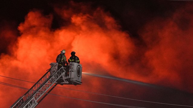 Firefighters battle a blaze at SPS Technologies in Jenkintown, Pa., Monday, February 17, 2025. (Photo by Matt Rourke/AP Photo)