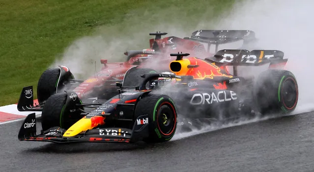Ferrari's Charles Leclerc and Red Bull's Max Verstappen drive side by side after the start of the Formula One Japanese Grand Prix at Suzuka Circuit in Suzuka, Japan on October 9, 2022. (Photo by Issei Kato/Reuters)