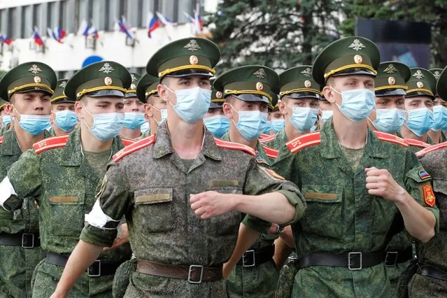 Militants of the self-proclaimed Donetsk People's Republic wearing protective face masks, used as a preventive measure against the spread of the coronavirus disease (COVID-19), march during a rehearsal for the Victory Day Parade in Donetsk, Ukraine, June 18, 2020. The military parade marking the 75th anniversary of the victory over Nazi Germany in World War Two was planned for May 9 but postponed due to the coronavirus outbreak. (Photo by Alexander Ermochenko/Reuters)