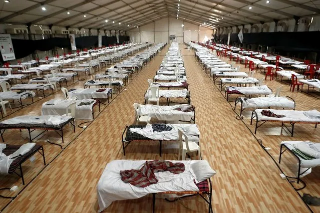 Beds are seen inside a recently constructed makeshift hospital and quarantine facility for patients diagnosed with the coronavirus disease (COVID-19) in Mumbai, India, June 11, 2020. (Photo by Francis Mascarenhas/Reuters)
