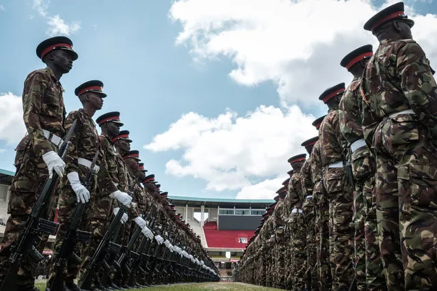 Kenyan army soldiers perform during the rehearsal of the inauguration ceremony of the President at the Moi International Sports Center's Kasarani Stadium in Nairobi on November 27, 2017. Uhuru Kenyatta will be sworn in for a second term as Kenya's President tomorrow on November 28, 2017. (Photo by Yasuyoshi Chiba/AFP Photo)