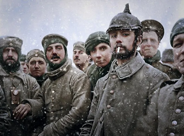 This stunning image shows the moment troops from the 5th London Rifle Brigade put down their weapons to stand with a German Saxon regiment during the Christmas truce of 1914. (Photo by Mario Unger/Mediadrumworld)