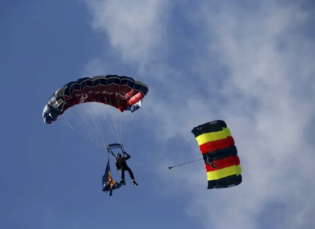 British Army parachutists from The Tigers, the Princess of Wales's Royal Regiment's Parachute display team, take part in a display during the Malta International Airshow at Malta International Airport, outside Valletta, Malta, September 27, 2015. (Photo by Darrin Zammit Lupi/Reuters)