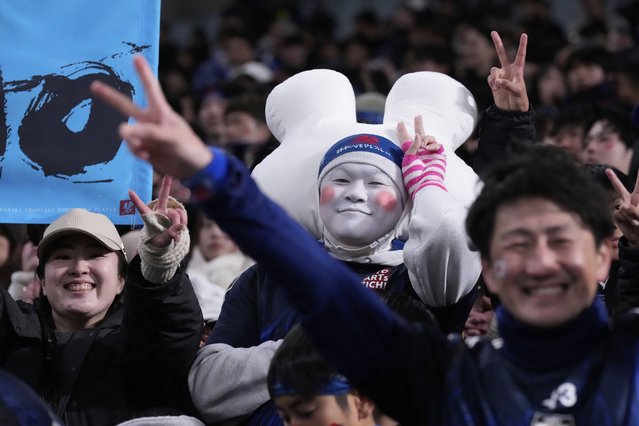 Fans celebrate after Japan defeated Bahrain in the World Cup qualifying soccer match at Saitama Stadium in Saitama, Japan, Thursday, March 20, 2025. (Photo by Eugene Hoshiko/AP Photo)