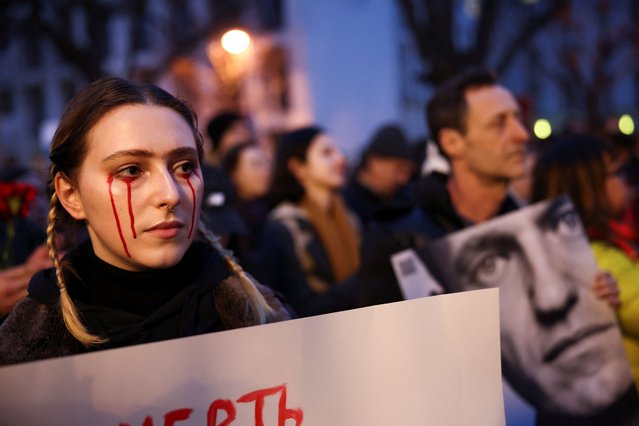 A woman looks on as she attends a vigil held in front of Russian embassy in Berlin after the death of Russian opposition leader Alexei Navalny, Germany, on February 16, 2024. (Photo by Liesa Johannssen/Reuters)