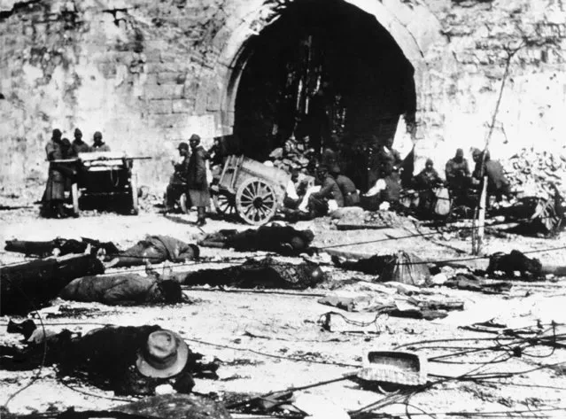 The dead litter the streets in Nanking, China, following the Japanese raid on this city, leaving it in utter devastation, December 14, 1937. (Photo by AP Photo)