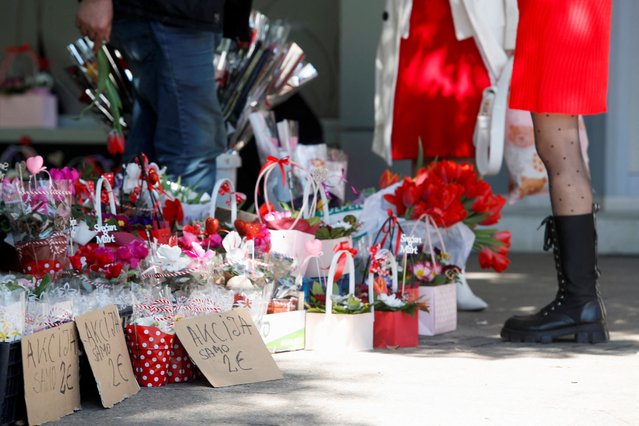 A street vendor sells flower arrangements on International Women's Day, in Podgorica, Montenegro on March 8, 2024. (Photo by Stevo Vasiljevic/Reuters)