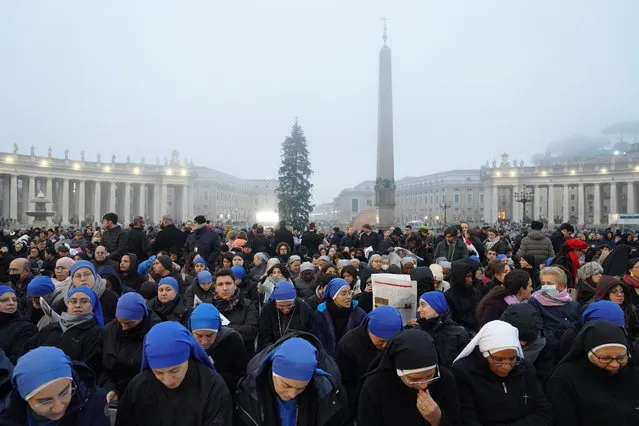 The crowd gathered at Saint Peter's Square in the Vatican for the funeral of Pope Benedict XVI on Thursday, January 5, 2023. Benedict lived inside the Vatican, mostly hidden from the public eye, since he resigned in 2013. His funeral, the first in modern history presided over by a reigning pope, included much of the grandeur of a funeral for a reigning pontiff, but with some significant exceptions. (Photo by Alessandro Grassani/The New York Times)