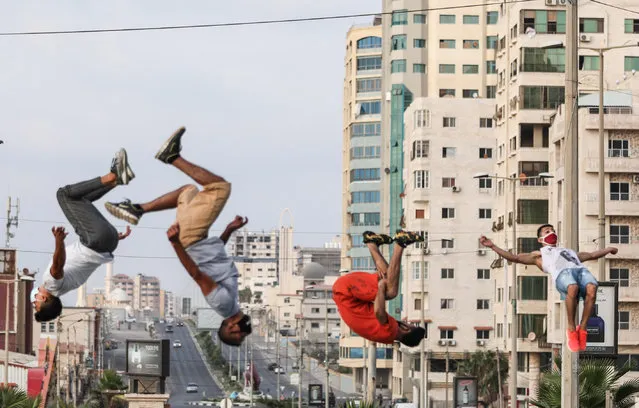 Young traceurs perform parkour in front of their houses following a full lockdown imposed on 24th August against the coronavirus (COVID-19) pandemic after the number of cases climbed, in Gaza City, Gaza on September 09, 2020. (Photo by Mustafa Hassona/Anadolu Agency via Getty Images)