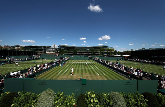 A general view of play over Court Ten as Ajla Tomljanovic of Australia and Viktoriya Tomova of Bulgaria play against Eri Hozumi of Japan and aldila Sutjaidi of Indonesia during the Ladies' Doubles first round match with Centre Court pictured in the background on day four of The Championships Wimbledon 2025 at All England Lawn Tennis and Croquet Club on July 03, 2025 in London, England. (Photo by Julian Finney/Getty Images)