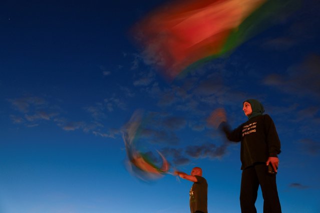 Demonstrators wave Palestinian flags as they take part in a vigil and rally honoring the lives of journalists and medics killed on Monday in Israeli strikes on Nasser hospital in Khan Younis, in the southern Gaza Strip, outside Union Station in Washington, D.C., U.S., August 27, 2025. (Photo by Jose Luis Gonzalez/Reuters)