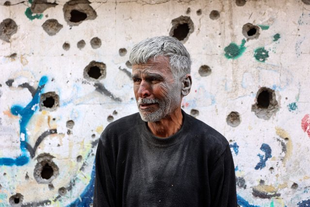 An elderly Palestinian man reactsas he stands in front of a building hit by an Israeli strike, in Gaza City's eastern neighbourhood of Shujaiya on April 10, 2025. In an update on April 10, the health ministry in the Hamas-run territory said at least 1,522 Palestinians have been killed in the renewed Israeli offensive, taking the overall death toll since the start of the war to 50,886. (Photo by Omar Al-Qattaa/AFP Photo)