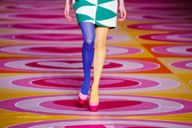 A model displays an outfit by Spanish designer Agatha Ruiz de la Prada with stockings in the colours of Ukraine's flag during the Mercedes Benz Fashion Week in Madrid, Spain, March 10, 2022. (Photo by Susana Vera/Reuters)