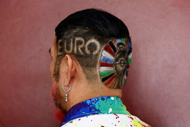 A medical radiologist Mitree Chitinunda, 52, poses for a picture with his hair tattoo of the EURO 2024 logo, ahead of the EURO 2024 semi-final soccer match between France and Spain, at a barber shop in Bangkok, Thailand on July 6, 2024. (Photo by Chalinee Thirasupa/Reuters)