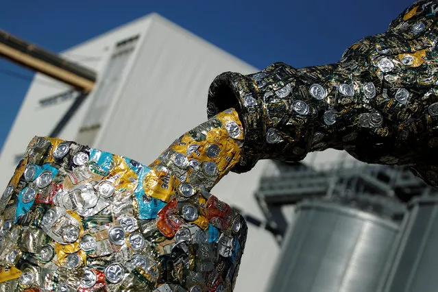 The 5-meter-tall “Bottle and glass” sculpture made of thousands of used beer cans by artists Nikola Simanic and Marko Petrovic Njegos is seen inside “Trebjesa” brewery in Niksic, Montenegro, October 31, 2016. (Photo by Stevo Vasiljevic/Reuters)