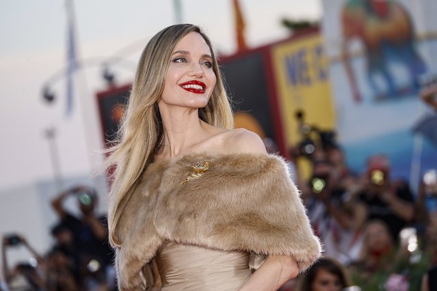 American actress Angelina Jolie poses for photographers upon her arrival for the premiere of the film “Maria” during the 81st edition of the Venice Film Festival in Venice, Italy, August 29, 2024. (Photo by Joel C Ryan/Invision/AP Photo)