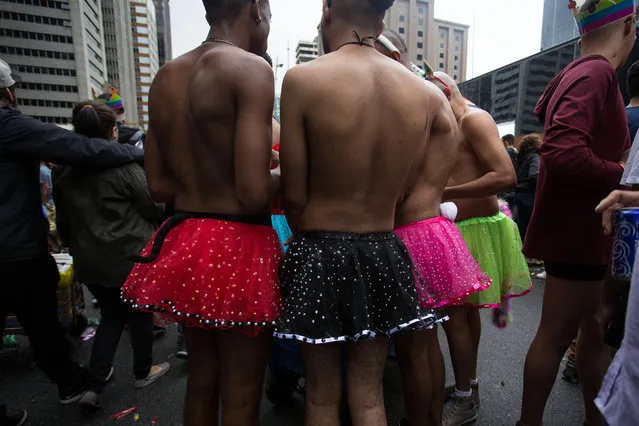 People attend the Gay Pride Parade on June 3, 2018 in Sao Paulo, Brazil. People gathered in Sao Paulo for the 22nd annual Gay Pride parade, which is considered one of the biggest ones in the world, (Photo by Rebeca Figueiredo/Getty Images)
