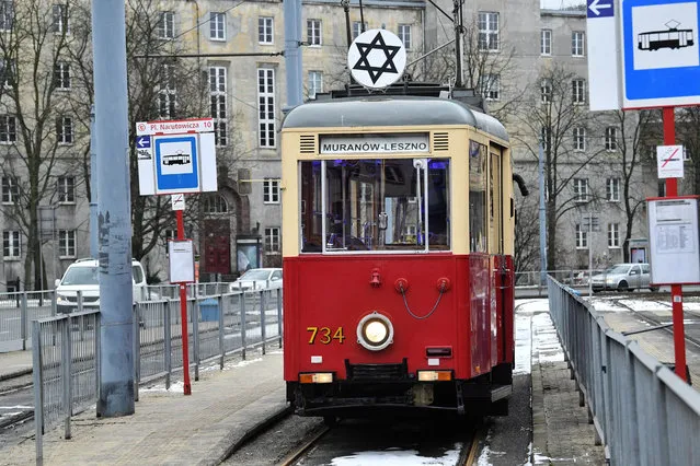 Historic tram marked with the Star of David in Warsaw, Poland, 27 January. Poland and the world mark the 76th International Holocaust Reme​mbrance Day. (Photo by Radek Pietruszka/EPA/EFE)