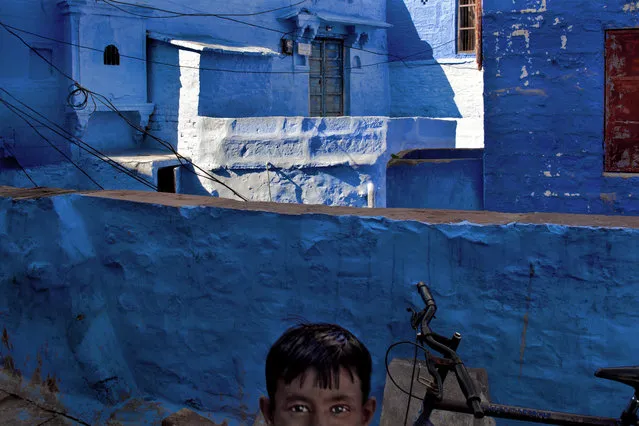 “Surprise”. A child by surprise, is captured during shooting of a part of the old city (Sun City) of Jodhpur (Rajasthan, India). (Photo and caption by Bruno Tamiozzo/National Geographic Traveler Photo Contest)