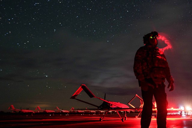 A Ukrainian commander, callsign Fidel of the 14th Separate Unmanned Aerial Systems Regiment, looks through night vision before takeoff, long-range drones An-196 Liutyi towards Russia in an undisclosed location, Ukraine, Tuesday, October 14, 2025. (Phoot by Evgeniy Maloletka/AP Photo)