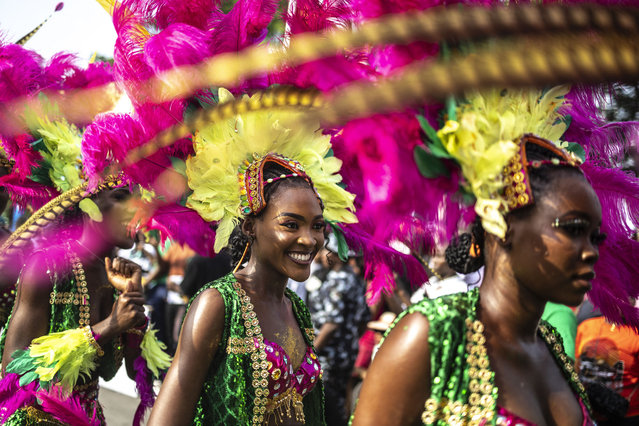 Participants dance as they parade during the Calabar Carnival in Calabar on December 28, 2024. Calabar Carnival is an annual carnival held in Cross River State, Nigeria: it is celebrated every December to mark Christmas celebration yearly. The quality of the festival has grown over the years making it Nigeria's biggest carnival and an internationally recognized festival. (Photo by Olympia de Maismont/AFP Photo)