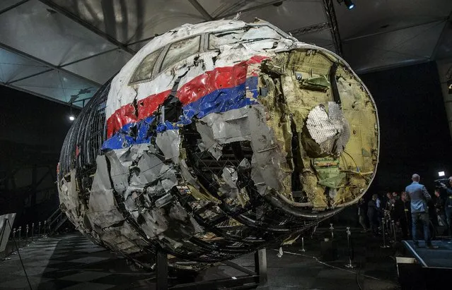 The reconstructed wreckage of the MH17 airplane is seen after the presentation of the final report into the crash of July 2014 of Malaysia Airlines flight MH17 over Ukraine, in Gilze Rijen, the Netherlands, October 13, 2015. (Photo by Michael Kooren/Reuters)