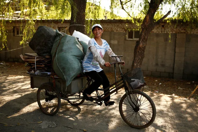 Scrap collector Liu delivers recyclables on a tricycle to a recycling yard at the edge of Beijing, China, August 30, 2016. (Photo by Thomas Peter/Reuters)