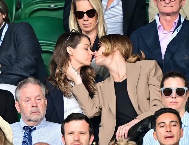 British singer Minke (L) and English model and actress Cara Delevingne kiss as they attend day eight of the Wimbledon Tennis Championships at All England Lawn Tennis and Croquet Club on July 10, 2023 in London, England. (Photo by Mirrorpix/The Mega Agency)