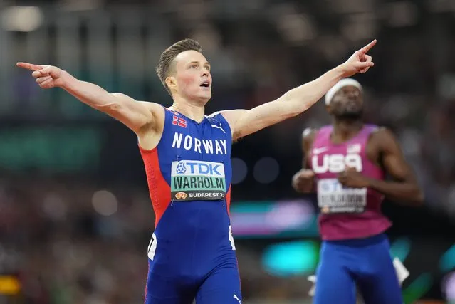 Karsten Warholm, of Norway celebrates winning the gold medal in the Men's 400-meters hurdles final during the World Athletics Championships in Budapest, Hungary, Wednesday, August 23, 2023. (Photo by Petr David Josek/AP Photo)
